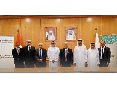 Professor Hamid M. K. Al Naimiy, Chancellor at the University of Sharjah, HE. Walid Al Hashimi, CEO of Sharjah Holding, and several senior members of both organisations