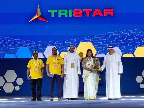 Tristar Group Chief Human Resource Officer Sheena Rajan receives the 4-Star trophy on behalf of the UAE operations of the company from Maj. Gen. Obaid Muhair Bin Suroor (center), Chairman Taqdeer Award and Permanent Committee of Labor Affairs in Dubai, and Dr. Abdulrahman Al Awar (right), Director General of the Federal Authority for Government Human Resources (FAHR). Accompanying her are Dinesh Indika Amarakoon (2nd left), Sr. Operations Supervisor, and Murari Mohandas (left), Workshop Steam Cleaner.