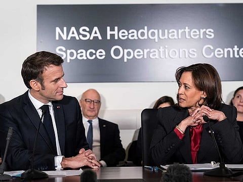 French President Emmanuel Macron, left, and Vice President Kamala Harris speak during a meeting to highlight space cooperation between the two countries, at NASA headquarters in Washington, Wednesday, Nov. 30, 2022.