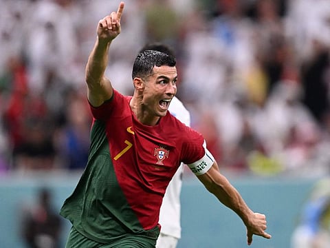 Portugal's Cristiano Ronaldo celebrates after scoring his team's first goal against Uruguay at Lusail Stadium.