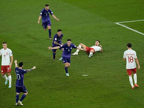 Argentina's Julian Alvarez (centre) celebrates with his teammates after scoring his side's second goal during the World Cup Group C match against Poland.