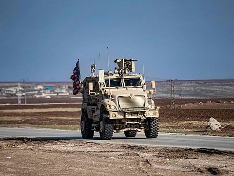 US forces patrol near the countryside of Rumaylan (Rmeilan) in Syria's northeastern Hasakeh province near the Turkish border, on December 2, 2022.