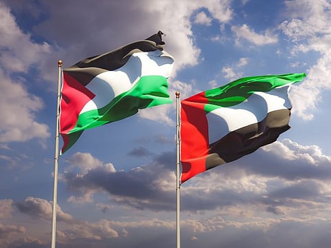 UAE flag (right) and Palestinian flag