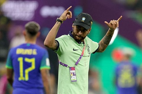Brazil's forward Neymar celebrates at the end of the Qatar 2022 World Cup Group G match against Cameroon at the Lusail Stadium in Lusail, north of Doha.