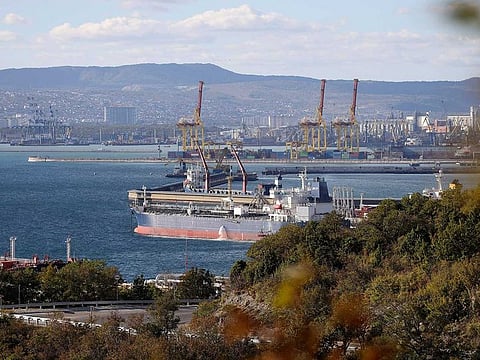 An oil tanker is moored at the Sheskharis complex, part of Chernomortransneft JSC, a subsidiary of Transneft PJSC, in Novorossiysk, Russia, Tuesday, Oct. 11, 2022, one of the largest facilities for oil and petroleum products in southern Russia. The European Union reached a deal Friday for a $60-per-barrel price cap on Russian oil, a key step as Western sanctions aim to reorder the global oil market to prevent price spikes and starve President Vladimir Putin of funding for his war in Ukraine. (AP Photo, File)