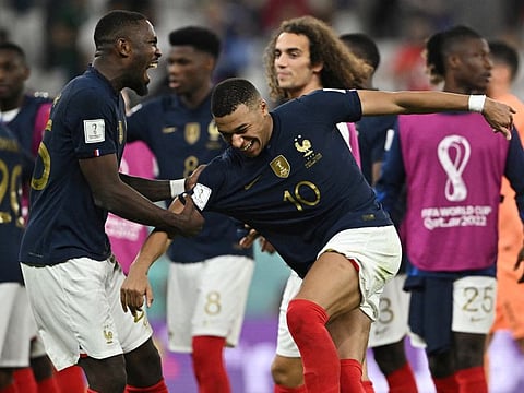 France's Kylian Mbappe, Marcus Thuram and teammates celebrate after the match against Poland as they progressed to the quarter finals of the FIFA World Cup.