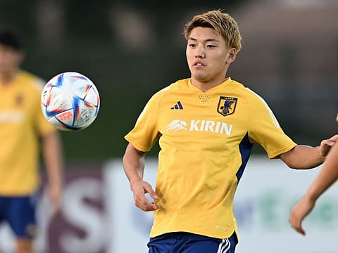Japan's Ritsu Doan takes part in a training session at the Al Sadd SC training grounds in Doha.