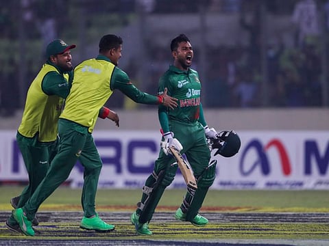 Bangladesh's Mehidy Hasan Miraz celebrates after winning the first one day international cricket match against India in Dhaka, Bangladesh.