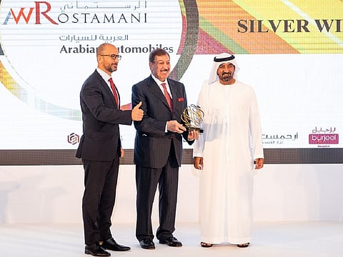 Sheikh Ahmed bin Saeed Al Maktoum, President, Dubai Civil Aviation Authority, Chairman and Chief Executive of Emirates Airline and Group, presents the award to Michel Ayat, CEO of AWR Automotive and Salah Yamout, COO of Arabian Automobiles