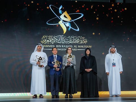 Sheikha Latifa bint Mohammed bin Rashid Al Maktoum standing with the winners of the seventh Mohammed bin Rashid Al Maktoum Knowledge Award at a ceremony on Tuesday in Dubai