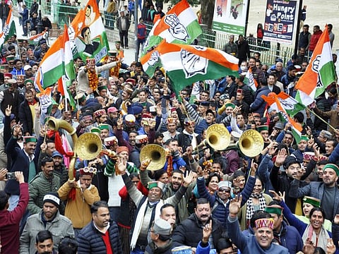 Congress supporters play musical instruments as they take out a rally to celebrate the party candidate Sundar Singh's victory in the Himachal Pradesh Assembly elections, in Kullu on Thursday, December 8, 2022.