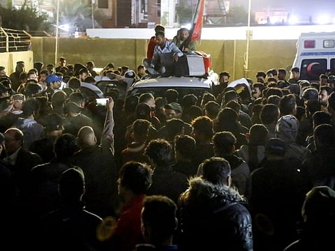 Mourners carry a coffin of a demonstrator, who was killed during an anti-government protest, during a funeral in the city of Nasiriya, Iraq, December 7, 2022.