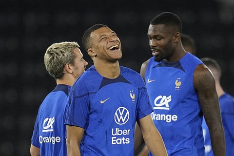 France's Antoine Griezmann (left), Kylian Mbappe (centre) and Marcus Thuram during a training session at the Jassim Bin Hamad stadium in Doha.