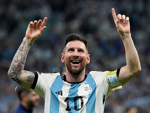 Argentina's Lionel Messi celebrates at the end of the World Cup quarterfinal soccer match between the Netherlands and Argentina.