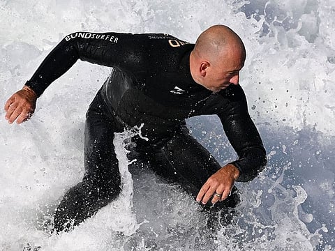 Australian surfer Matt Formston, who is blind, competes in his heat on the second day of competition at the World Para Surfing Championship in Pismo Beach.