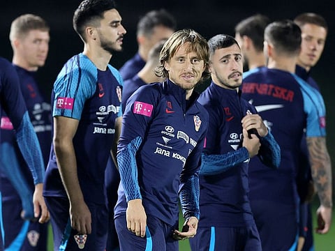 Croatia's midfielder Luka Modric (centre) takes part in a training session in Doha, ahead of their Qatar World Cup semi-final match against Argentina.