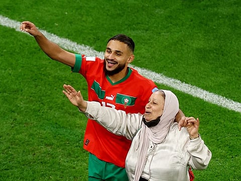 Morocco’s Sofiane Boufal celebrates with his mother after defeating Portugal in the FIFA World Cup Qatar 2022 quarterfinal football match at the Al Thumama Stadium in Doha on December 10, 2022. The win made Morocco the first Arab and African nation to enter the World Cup semifinals.