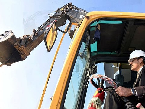 Sindh Chief Minister, Syed Murad Ali Shah, operates excavator to break ground for construction of new 500 KV interchange grid of Karachi Electric.