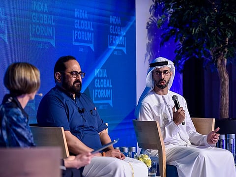 UAE's Omar bin Sultan Al Olama and India's Rajeev Chandrasekhar in conversation at the India Global Forum in Dubai.