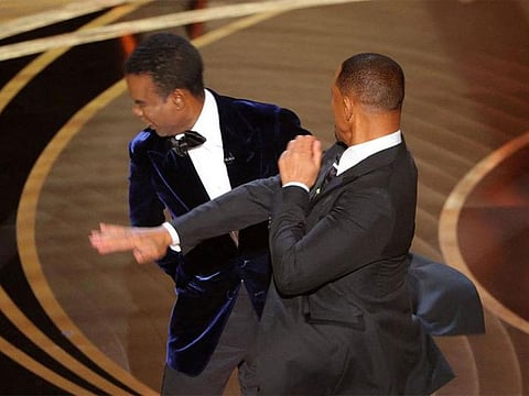 Will Smith hits at Chris Rock as Rock spoke on stage during the 94th Academy Awards in Hollywood.