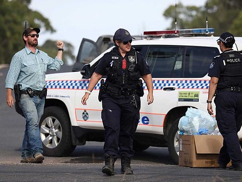 Police work near the scene of a fatal shooting in Wieambilla, Australia, Tuesday, Dec. 13, 2022.