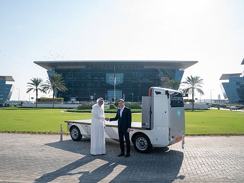 Mohsen Ahmad, CEO of the Logistics District — Dubai South, and Andrey Bolshakov, Founding CEO, Evocargo, stand next to the driverless truck after the MoU signing ceremony