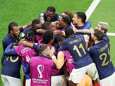 French team celebrates after they qualified for the World Cup finals, beating Morocco, at Al Bayt Stadium, in Al Khor on Thursday.