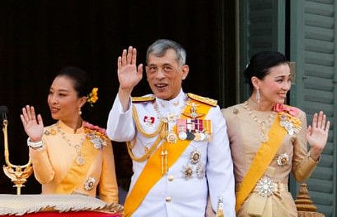 Thailand's newly crowned King Maha Vajiralongkorn, Queen Suthida and Princess Bajrakitiyabha are seen at the balcony of Suddhaisavarya Prasad Hall at the Grand Palace where King grants a public audience to receive the good wishes of the people in Bangkok, Thailand May 6, 2019.