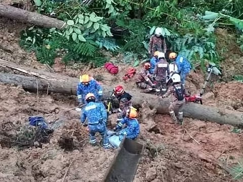 Malaysia's Special Civil Defence Force Team (PASPA) and Selangor department in a search and rescue operation for landslide victims at Genting Highlands.