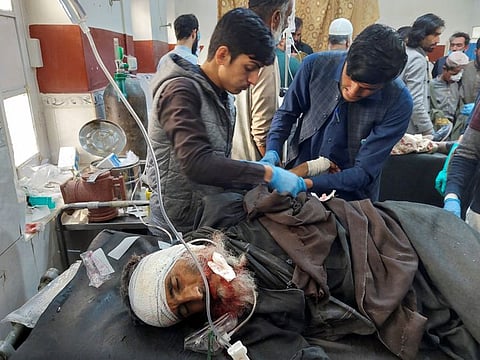 A man injured during cross-border shelling and gunfire, receives first aid at a hospital in the Pakistan-Afghanistan border town of Chaman, Pakistan December 15, 2022.