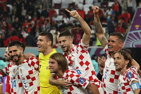 Croatia's players celebrate after winning the Qatar 2022 World Cup third place play-off against Morocco at Khalifa International Stadium in Doha.