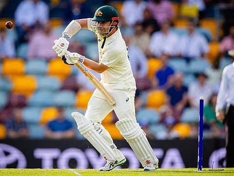 Australia's Travis Head drives during day one of the first cricket Test match between Australia and South Africa at the Gabba in Brisbane.