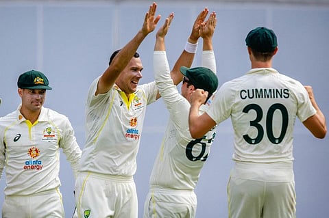 Australia's Scott Boland (second left) celebrates the wicket of South Africa's Marco Jansen during day two of the first Test at the Gabba in Brisbane.