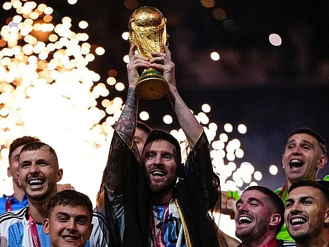 Argentina skipper Lionel Messi holds aloft the World Cup in Qatar in 2022.
