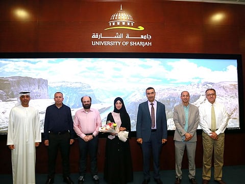 Fatima Al-Khateri (fourth from left) becomes the first female Emirati student to receive a Master’s Degree in Astronomy and Space Sciences from the University of Sharjah (UoS).