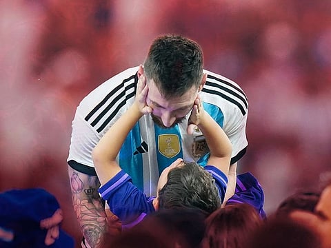 Lionel Messi celebrates with his son after Argentina defeated France in the World Cup final in Qatar to cap his fifth tour in the tournament