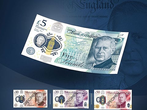 A handout photograph released by the Bank of England in London on December 19, 2022 shows the design of the new five, ten, twenty and fifty pound polymer banknotes featuring a portrait of Britain's King Charles III.