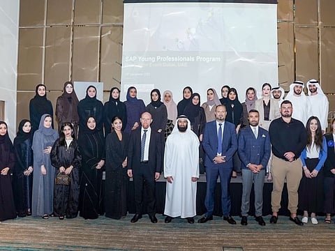 Graduates during a ceremony attended by Abdullah Ali bin Zayed Al Falasi, Director General of DGHR, and several officials from Dubai government departments.