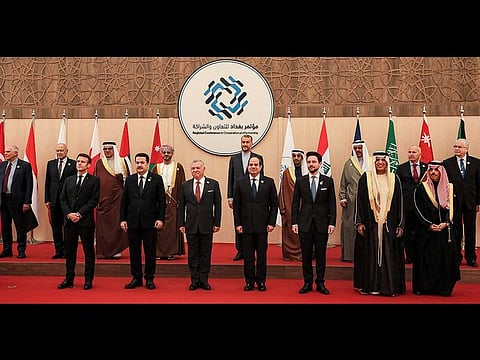 (Front L to R) French President Emmanuel Macron, Iraq's Prime Minister Mohamed Shia Al Sudani, Jordan's King Abdullah, Egypt's President Abdel Fattah Al Sisi, Jordan's Crown Prince Hussein, Sheikh Saud bin Saqr Al Qasimi, Supreme Council Member and Ruler of Ras Al Khaimah, Saudi Arabia's Foreign Minister Prince Faisal bin Farhan Al Saud; along with the High Representative of the European Union for Foreign Affairs and Security Policy Josep Borrell (Behind L), Arab League Secretary-General Ahmed Aboul-Gheit (2nd-L), Iranian Foreign Minister Hossein Amir-Abdollahian (Behind 5th-L), and other dignitaries pose together in at the start of the 'Baghdad Conference for Cooperation and Partnership' in Sweimeh by the Dead Sea shore in central-west Jordan on December 20, 2022.