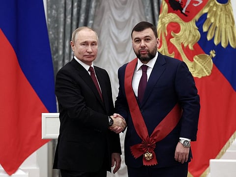 Russian President Vladimir Putin awards Denis Pushilin, Russian-installed acting leader of the Moscow-controlled parts of Ukraine's Donetsk region, with the order "For Merit to the Fatherland" of the first class during a ceremony at the Kremlin in Moscow, Russia December 20, 2022.