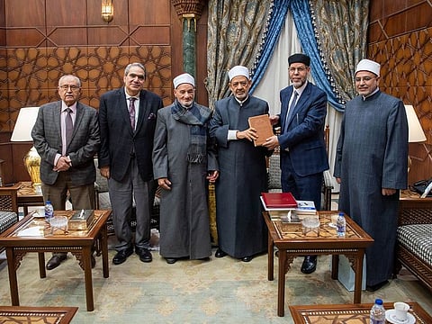 Ahmed El-Tayeb, the Grand Imam of Al-Azhar (third from right) receiving the historic dictionary of Arabic Language from a delegation of the Arabic Language Academy, Sharjah.