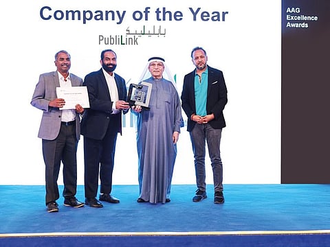 Ebrahim Ahmed Al Abbas, Chairman, Al Abbas Group handing over the ‘Company of the Year Award’ to Reghu Menon, Managing Director, Publilink in the presence of Dheeraj Thakur and Sunil Roy
