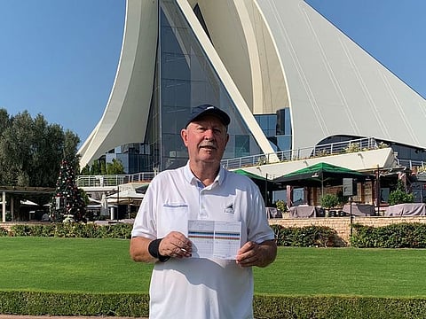 John Fellingham proudly displaying his scorecard of 70 to match his age at Dubai Creek Golf & Yacht Club.
