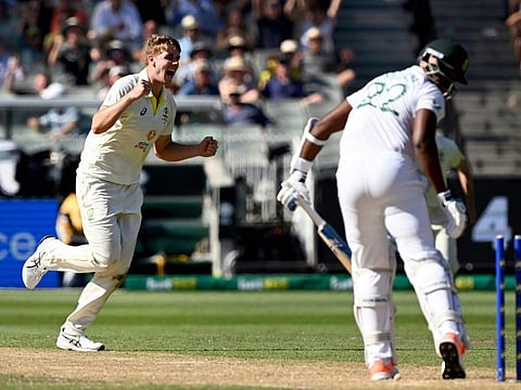 Australia's Cameron Green (left) celebrates dismissing South African batsman Lungi Ngidi (right) on the first day of the second Test at the MCG in Melbourne.