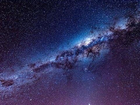 The Milky Way's halo is vastly larger than the galaxy's main disk and central bulge that are teeming with stars.