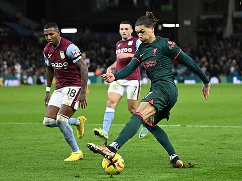Liverpool's Uruguayan striker Darwin Nunez (right) controls the ball during the English Premier League match against Aston Villa at Villa Park in Birmingham, central England.