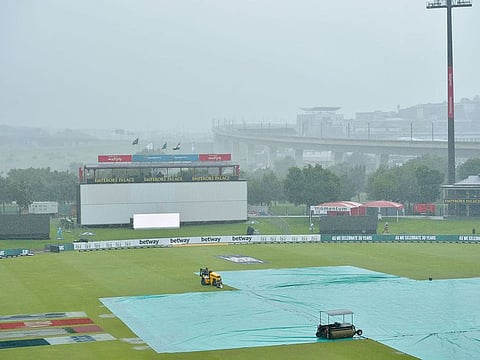Rain covers are seen on the pitch ahead of the second day of the first Test between South Africa and India at SuperSport Park in Centurion on Monday.