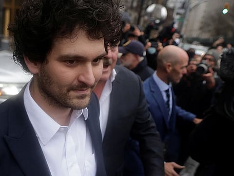 Former FTX chief executive Sam Bankman-Fried, who faces fraud charges over the collapse of the bankrupt cryptocurrency exchange, walks from the Manhattan federal court after securing bail in New York City.