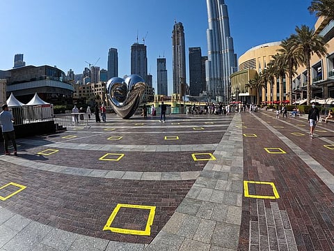 Yellow markings have been placed on pavements and walkways in the Downtown area of Dubai ahead of New Year's Eve celebrations in order to ensure strict adherence to social distancing guidelines.