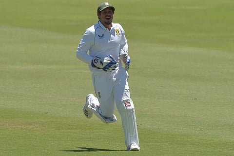 South African wicketkeeper Quinton de Kock celebrates the dismissal of Cheteshwar Pujara during the fourth day of the first Test against India at SuperSport Park in Centurion on Wednesday.